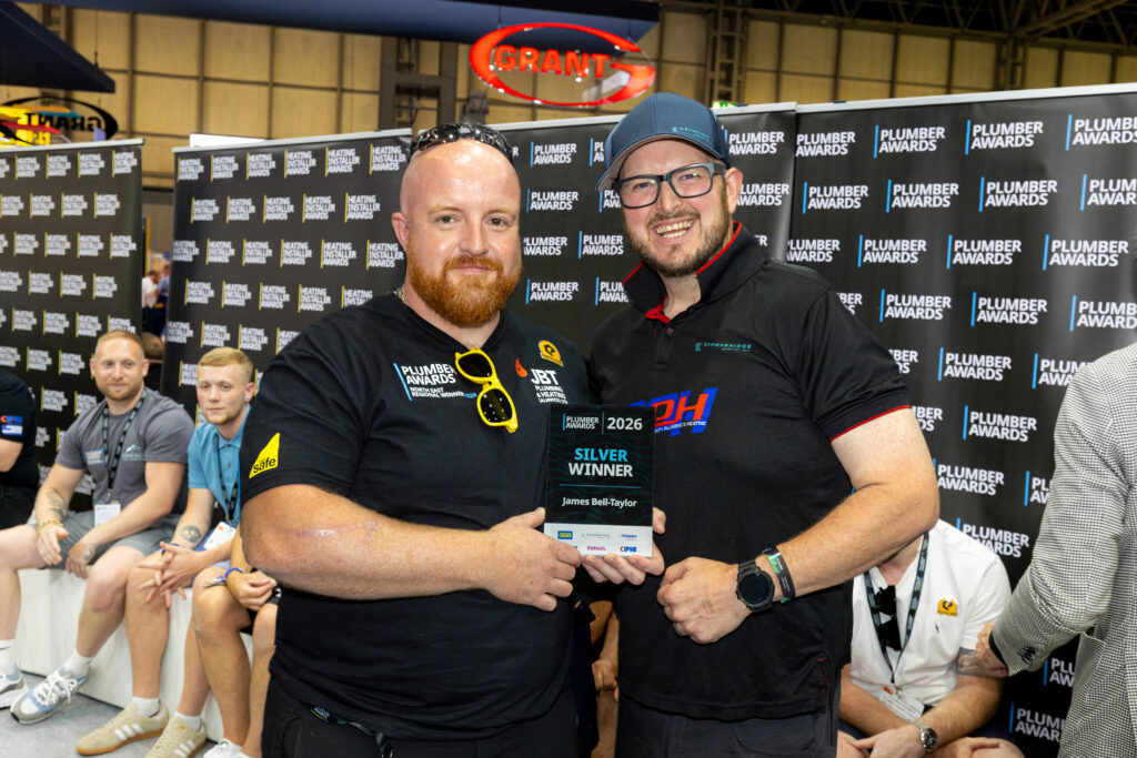 James Bell-Taylor receiving his Plumber Awards 2026 trophy at InstallerSHOW
