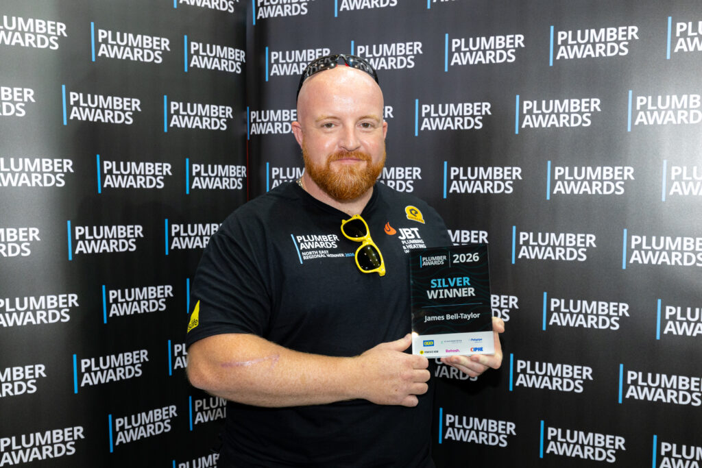 James Bell-Taylor holding his Plumber Awards 2026 Silver Winner trophy