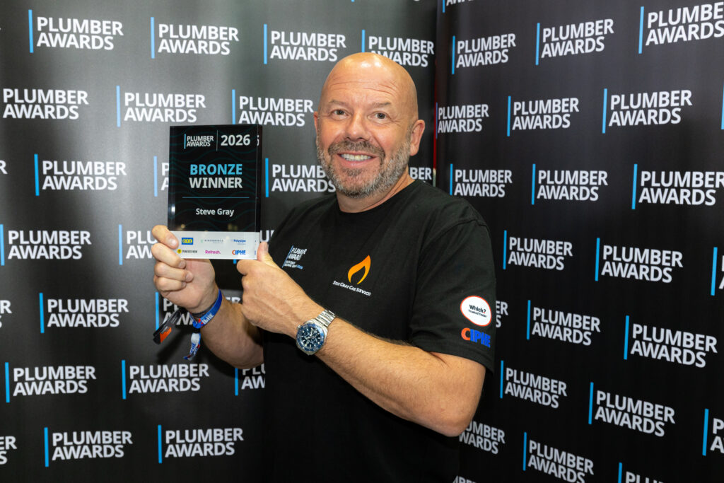 Steve Gray holding his Plumber Awards 2026 Bronze Winner trophy
